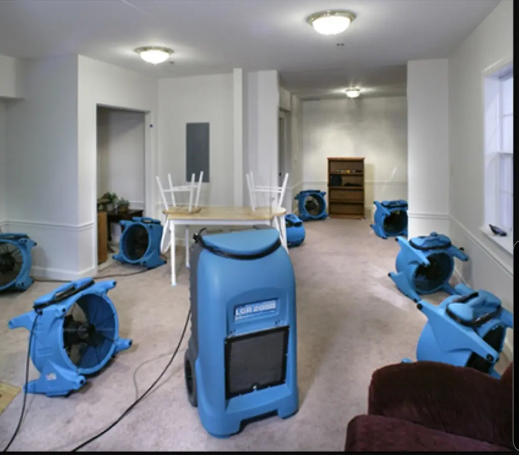 Air movers and dehumidifier setup for Water Damage Restoration in Larkin